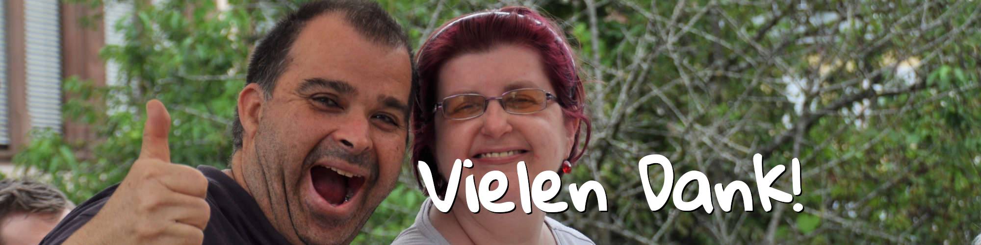 Zwei lachende Menschen. Schriftzug: Vielen Dank